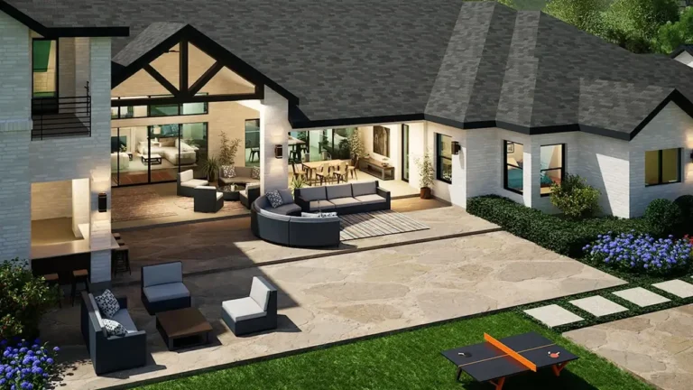 Covered outdoor living area with comfortable seating and landscaped backyard at the Wellington Lane house plan.